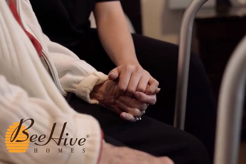 Senior Elder Holding hands with Caregiver in New Mexico